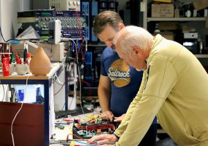 Designers testing XTA equipment on a work bench